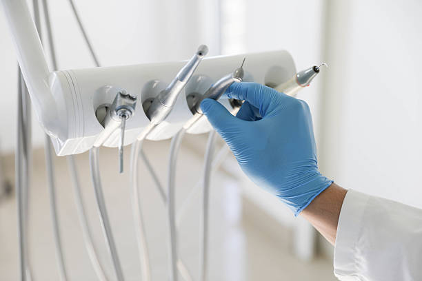 Professional Tooth Extraction technician working in East Providence, RI